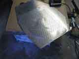 Protective aluminum screen mounted on plate
